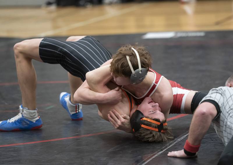 Huntley's Alessio Pezzella gets control of Crystal Lake Central's Tommy Tomasello during the 145 pound match on Thursday, January 27, 2022 at Huntley High School.