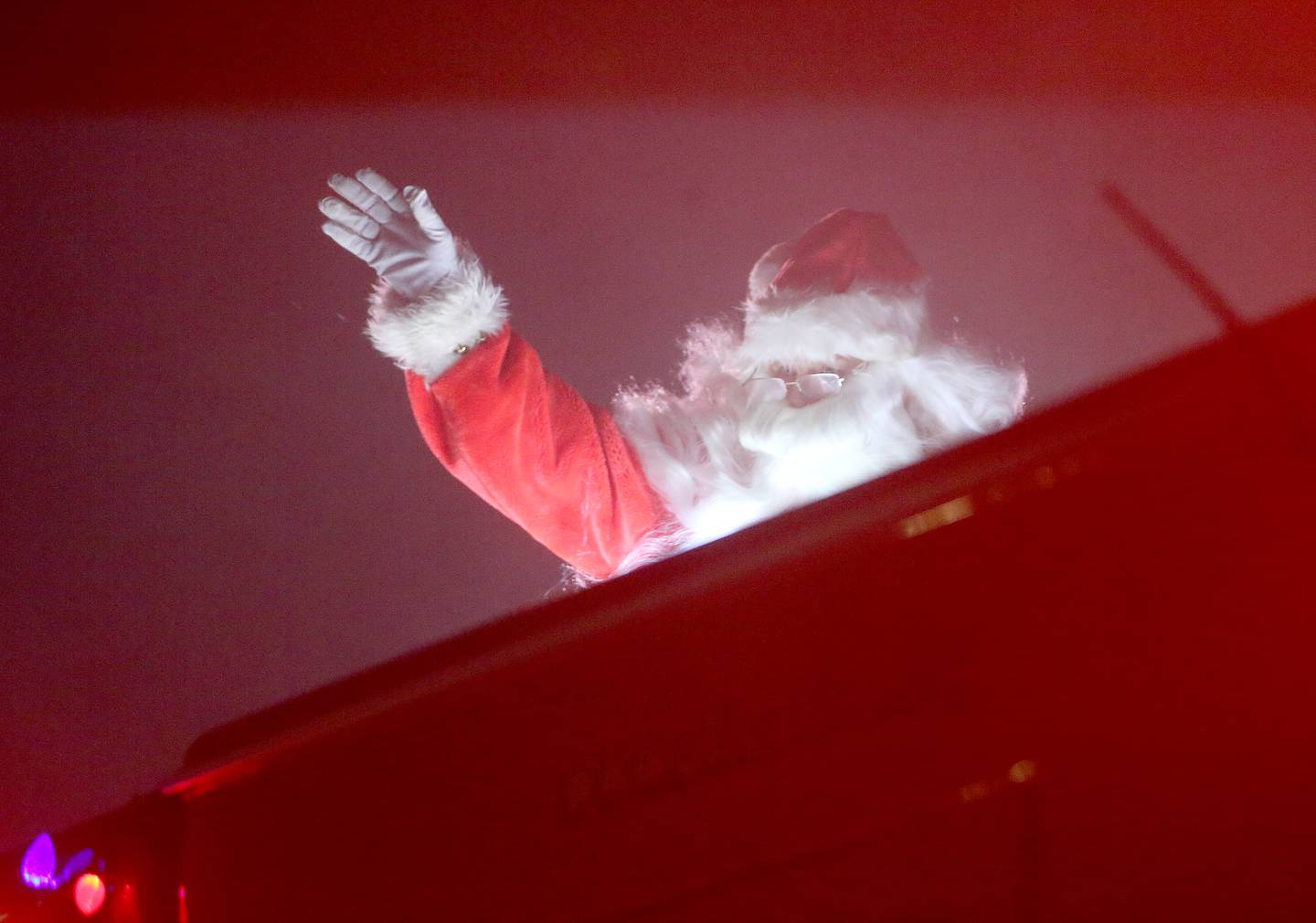 Santa Claus rides in a Utica Fire engine during the Utica Fire Department Santa parade on Saturday, Dec. 23, 2023. Santa took time out of his busy schedule to parade through most of the the Village of Utica bringing cheer to children of all ages. The Utica Fire Protection District has been hosting Santa since December 1941 and is one of the oldest Santa parades in the Illinois Valley. Each December, the Utica Fire Department escorts Santa throughout subdivisions and parades throughout the village.