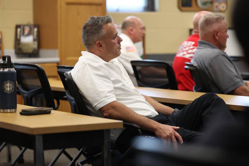 Battalion Chief John Koch sits in on a Crisis First Aid refresher course for the Joliet Fire Department Station One crew on Wednesday, July 12th, 2023 in Joliet.