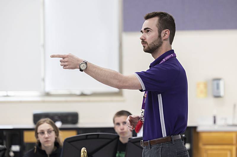 Dixon High School band director Riley Carter conducts his band Tuesday, April 11, 2023. Carter and company are practicing for the upcoming music contests.