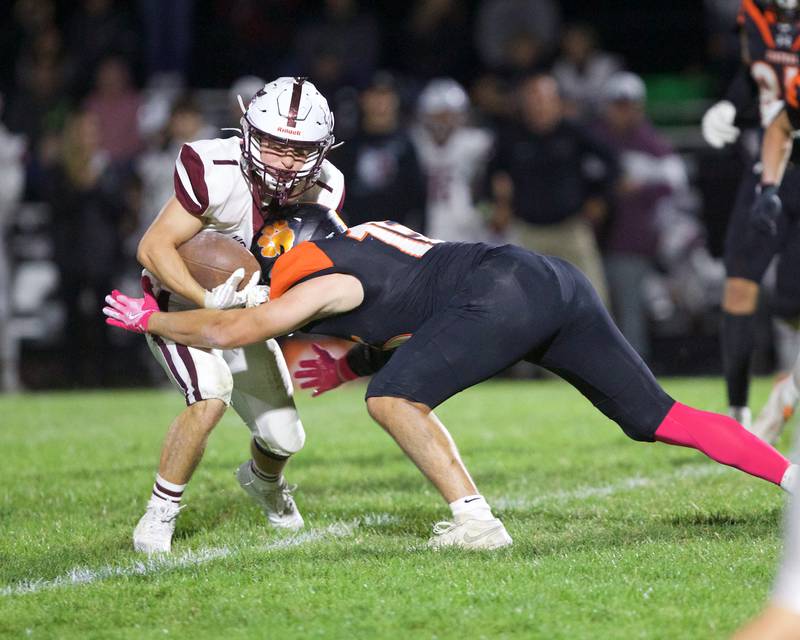 Prairie Ridge's Nick Petty is sacked by Crystal Lake Central's Cayden Parks on Friday, Oct.18, 2024 in Crystal Lake.