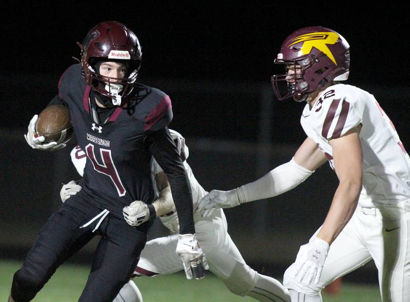 Marengo’s Parker Mandelky runs the ball as Richmond Burton’s Breckin Campbell prepares to block in varsity football at Rod Poppe Field on the campus of Marengo High School in Marengo on Friday, Oct. 18, 2024.