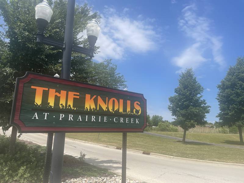 The sign outside the Knolls At Prairie Creek subdivision is seen June 24, 2024 in DeKalb