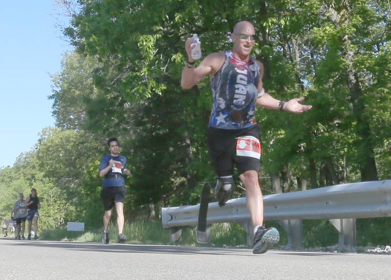 Juan Leg of Oglesby, runs during the Starved Rock Marathon and Half Marathon on Saturday, May 11, 2024 at Starved Rock State Park.