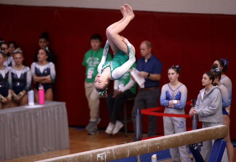 York’s Melania Veselovsky competes on the balance beam during the IHSA Girls State Gymnastics Meet at Palatine High School on Friday, Feb. 16, 2024.