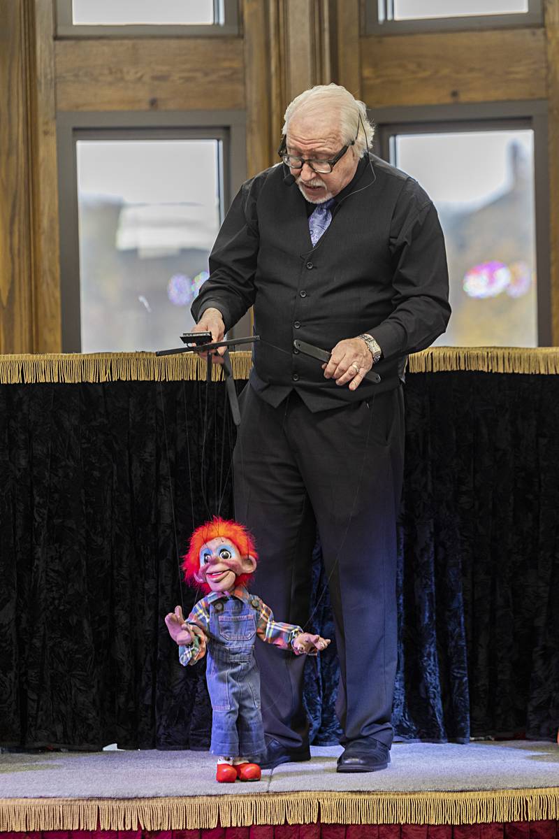 Dave Herzog introduces Billy Bob to the crowd at the Dixon library Thursday, Nov. 16, 2023. Herzog is performing his marionette show “The Pumpkin Patch Review.”