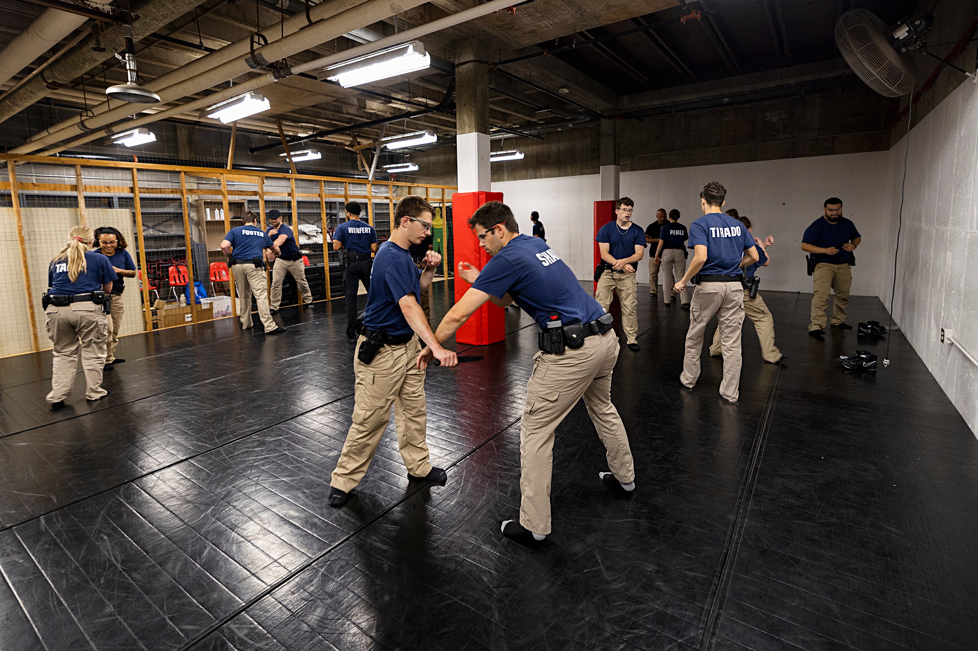 Kenneth Malo (left) and Spencer Shaw work defense of dealing with a subject with a knife Wednesday, July 17, 2024, at the Sauk Valley Police Academy.