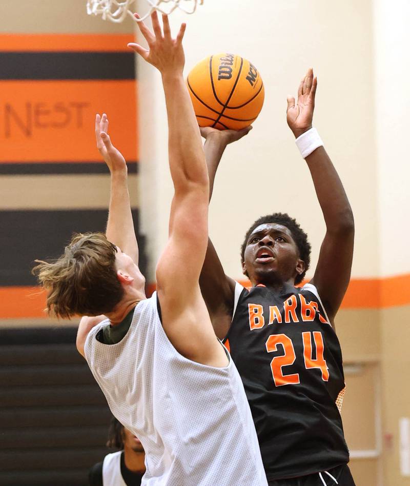 DeKalb’s Myles Newman goes to the basket during their summer game against Elk Grove Tuesday, June 18, 2024, at DeKalb High School.