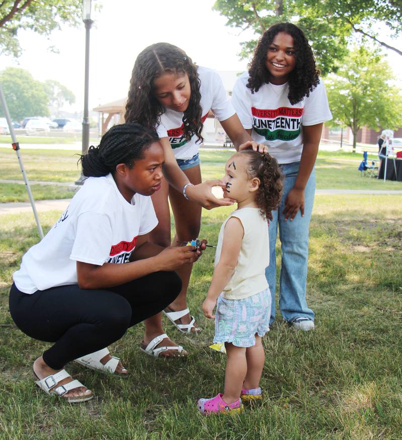 Andrea Roush, 2, of Sterling has he face painted by volunteers Saturday, June 17, 2023 in Sterling. The Juneteenth celebration, held the at the Grandon Civic Center featured a touch a truck, music, poetry food and vendors.