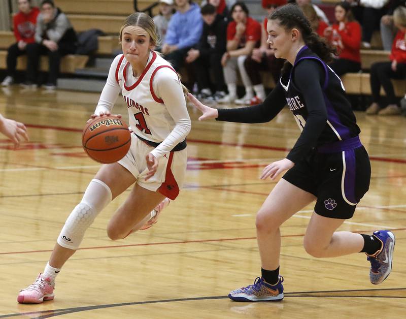 Huntley's Anna Campanelli drives the lane agains tHampshire's Ashley Herzing during a Fox Valley Conference girls basketball game Monday, Jan. 30, 2023, at Huntley High School.