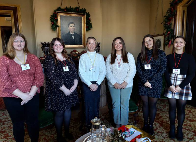 (From left) Mackenzie Manke, of Serena High School; Kate Biros, of Seneca High School; Emma Cushing, of Ottawa High School; Jenna Gamons, of Marquette Academy; Abby Mascal, of Streator High School; and Lanee Lucas, of Woodland High School pose for a photo Thursday, Dec. 7, 2023, at Reddick Mansion in Ottawa after they were honored during the Illini Chapter of the Daughters of the Revolution Good Citizen Award ceremony.