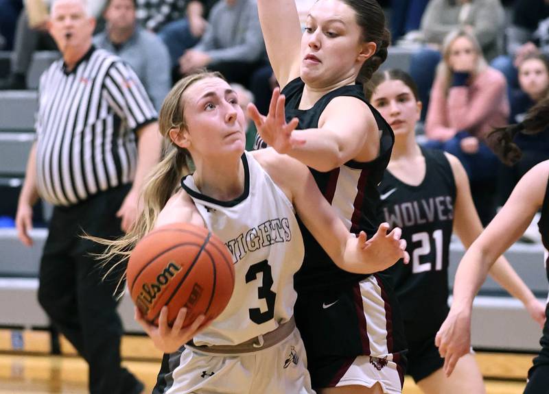 Kaneland's Alexis Schueler tries to shoot around Prairie Ridge's Addison Gertz Thursday, Feb 15, 2024, during their Class 3A regional final game at Kaneland High School in Maple Park.