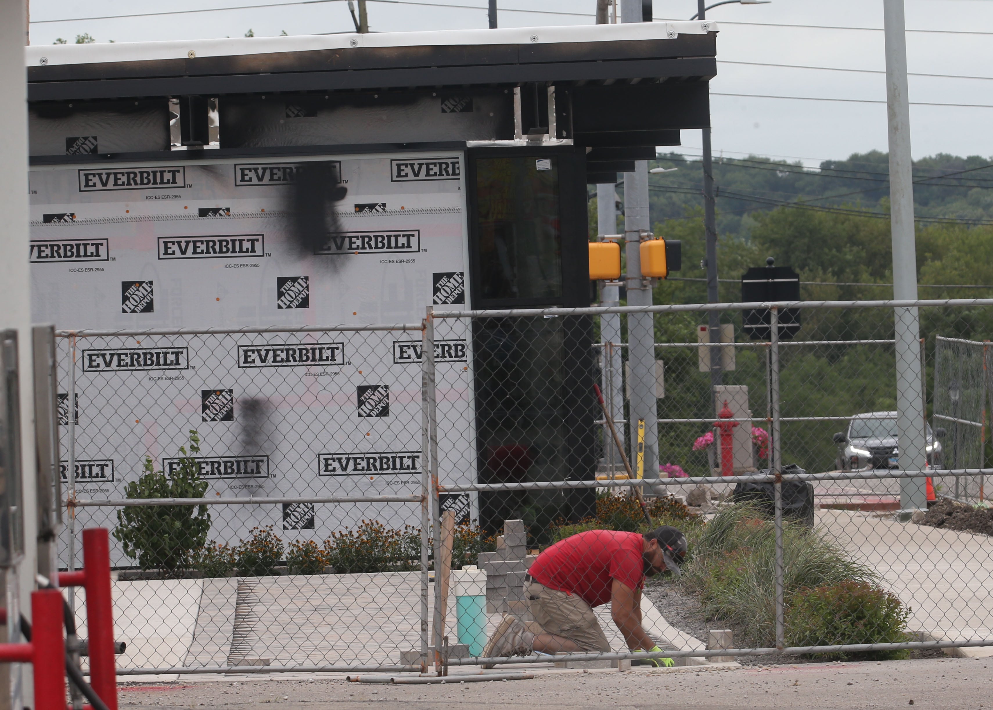 A worker lays patio blocks behind the former Maytag Building on Tuesday, Aug. 6, 2024 downtown La Salle.