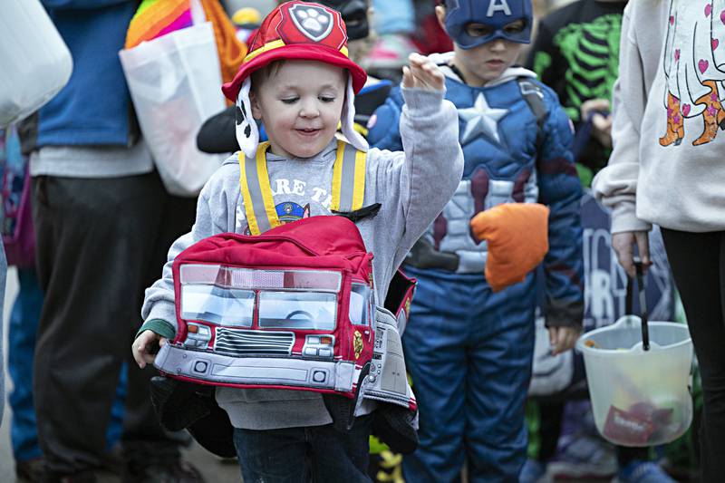 Sawyer Smith, 3, tosses a beanbag at the My Play Village booth at Washington School in Dixon Wednesday, Oct. 25, 2023. The trunk or treat event had about 30 local organizations handing out candy and other treats.