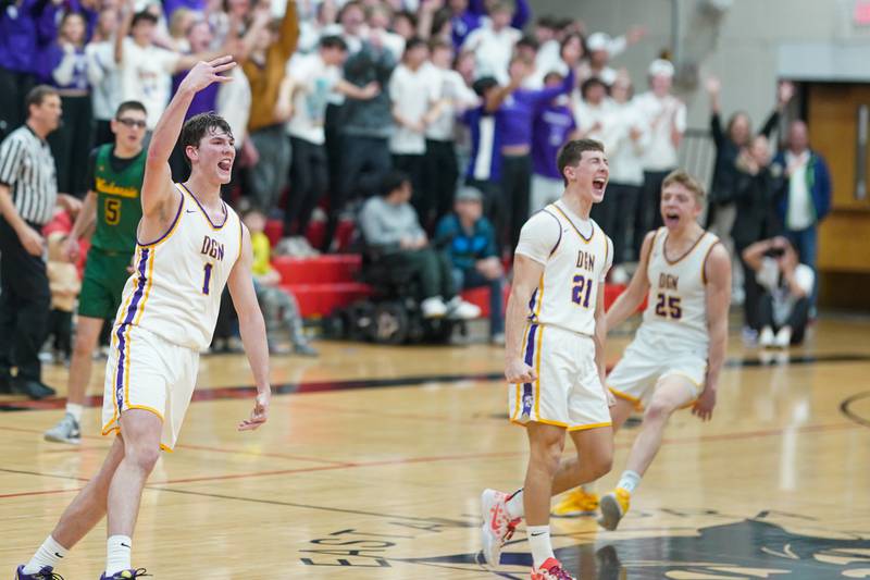 Downers Grove North's Jake Riemer (1) reacts after sinking a three point shot during a Class 4A East Aurora sectional semifinal basketball game against Waubonsie Valley at East Aurora High School on Wednesday, Feb 28, 2024.