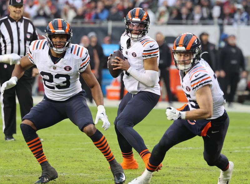 Chicago Bears quarterback Justin Fields looks for a receiver in the Arizona Cardinals secondary during their game Sunday, Dec. 24, 2023, at Soldier Field in Chicago.