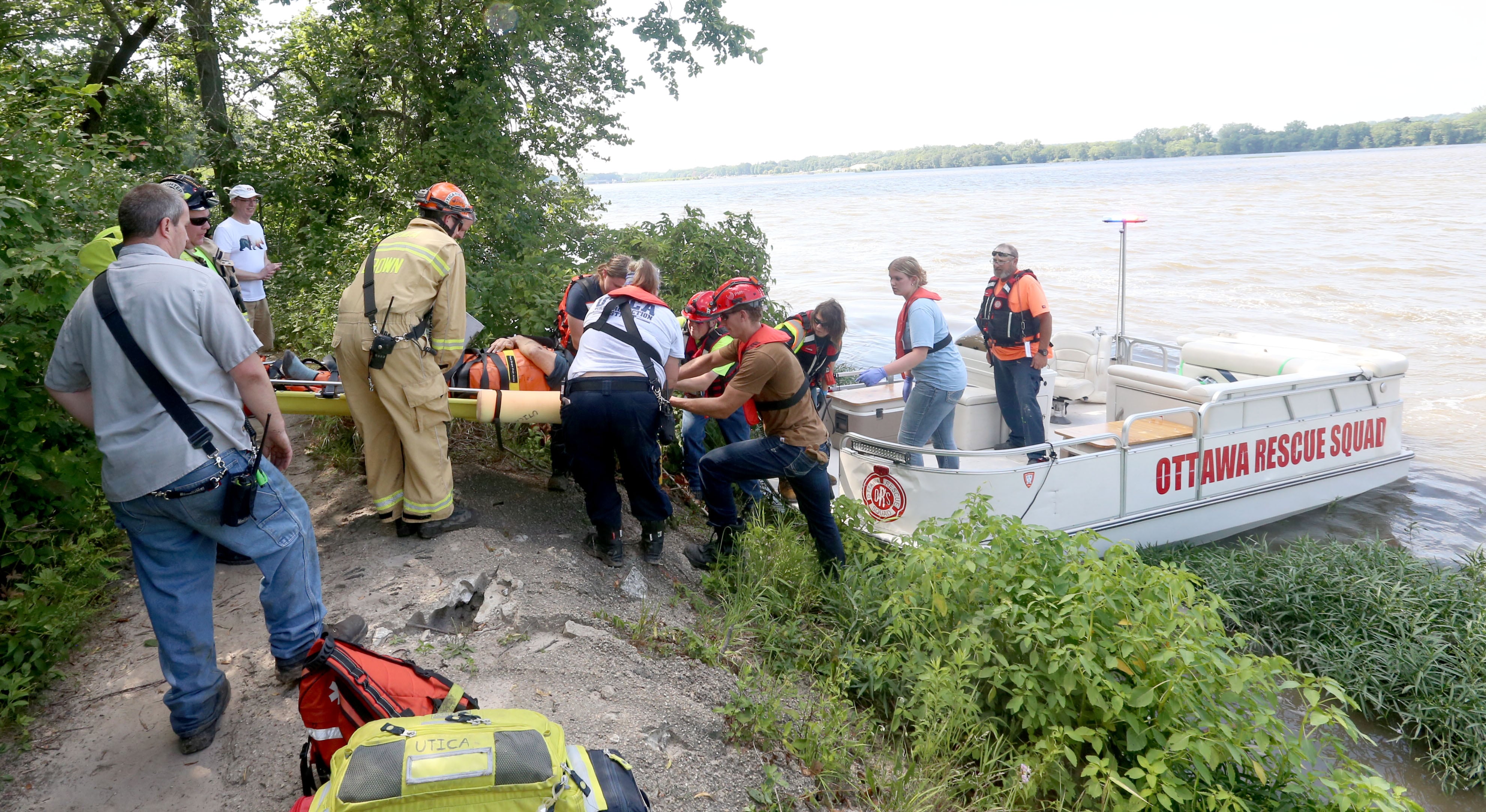 Oglesby and Utica Fire and EMS load a male subject into a Ottawa River Rescue  boat near the trailhead to La Salle Canyon on Wednesday, July 17, 2024 at Starved Rock State Park.