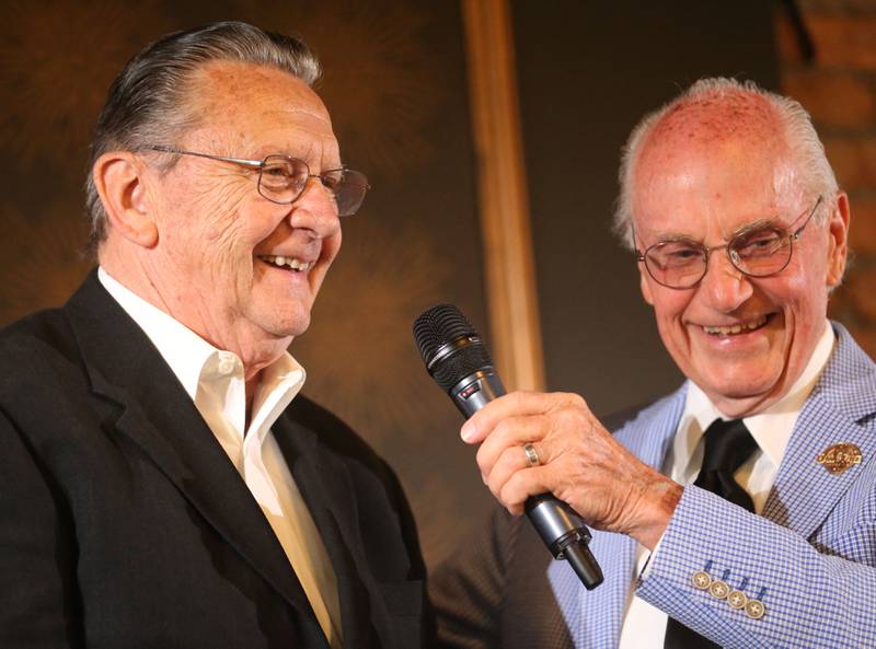 Ted Schmitz smiles with emcee Lanny Slevin during the Illinois Valley Sports Hall of Fame awards banquet on Thursday, June 6, 2024 at the Auditorium Ballroom in La Salle.