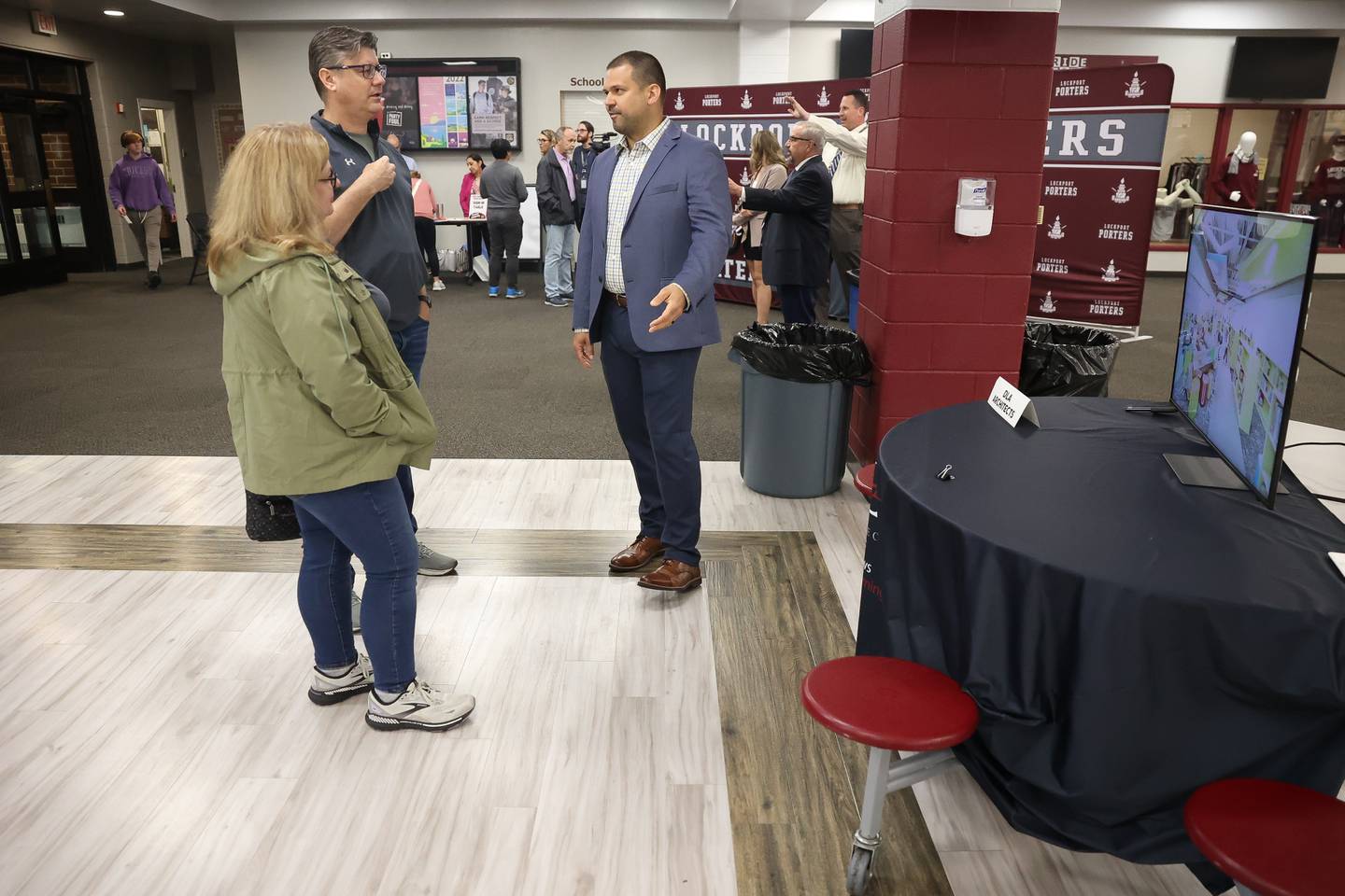 Rich Kocek, right, with DLA Architiects talks with Doug and Karen Dillon at the LTHS Community Open House on Monday, May 13, 2024 in Lockport.