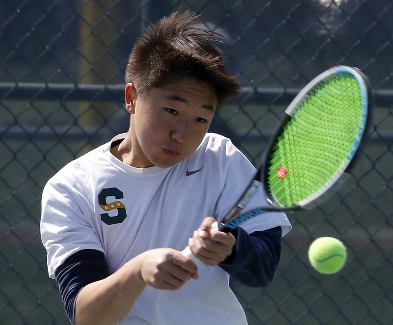 Stevenson's Dustin Zhao returns the ball during an IHSA 2A boys doubles tennis match Thursday, May 25, 2023, at Buffalo Grove High School.