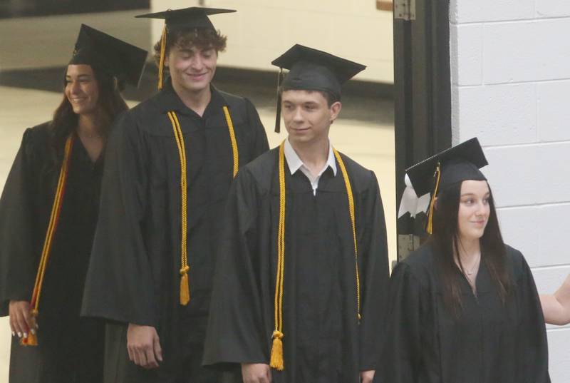 Putnam County High School graduates enter the gymnasium during graduation on Sunday, May 19, 2024 at Putnam County High School.