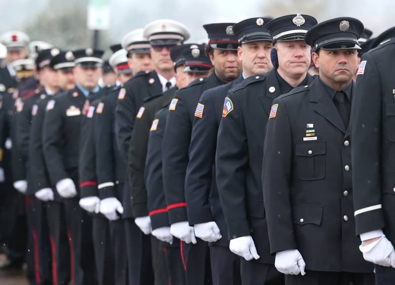 Firefighters from all around the area file in Saturday, Jan. 6, 2024, to the visitation for Sycamore firefighter/paramedic Bradley Belanger at the Sycamore Park District Community Center. Belanger, 45, who worked with the Sycamore Fire Department for more than two decades, died Friday, Dec. 22, after a yearlong battle with cancer.