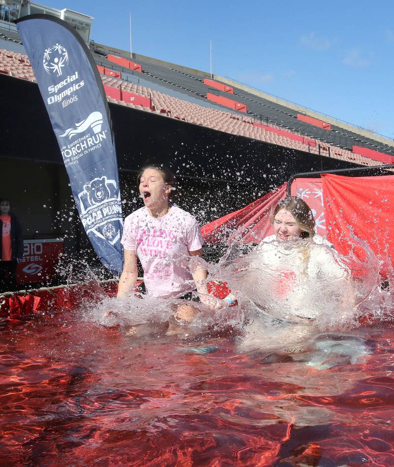 Members of the Alpha Sigma Alpha sorority jump into the water on a cold and windy Saturday, Feb 17, 2024, during the Huskie Stadium Polar Plunge at Northern Illinois University in DeKalb. The Polar Plunge is the signature fundraiser for Special Olympics Illinois.