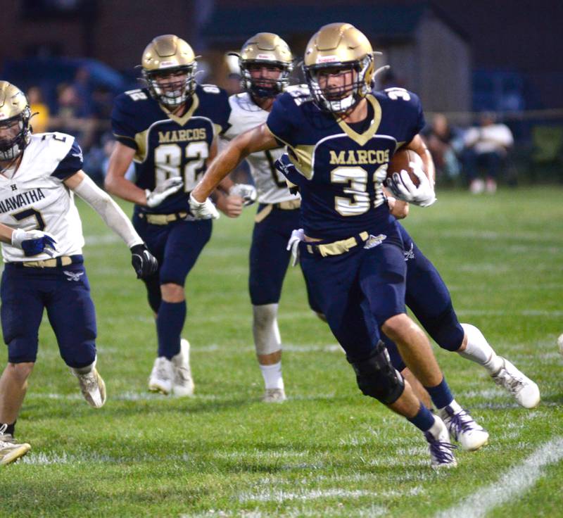 Polo's Noah Dewey (31) moves up the sideline for extra yards during 8-man football action against Hiawatha on Friday, Sept. 13, 2024 in Polo.