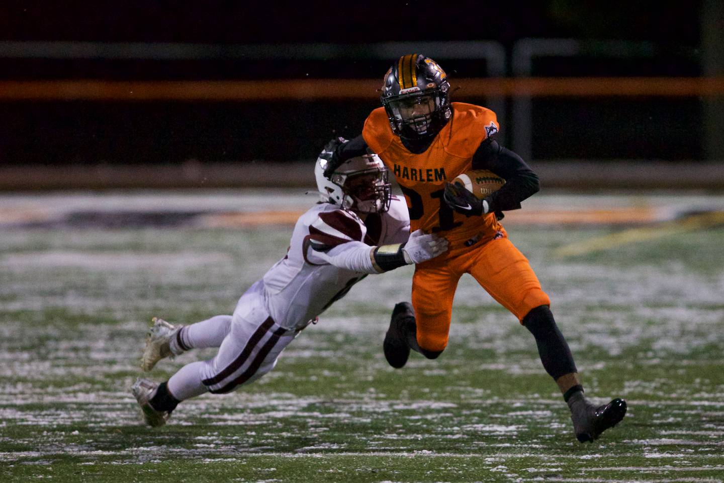 Harlem's Jahmani Muhammad is tackled by Prairie Ridge's Dominic Creatore at the Class 6A Quarter Finals on Saturday, Nov. 12,2022 in Machesney Park.