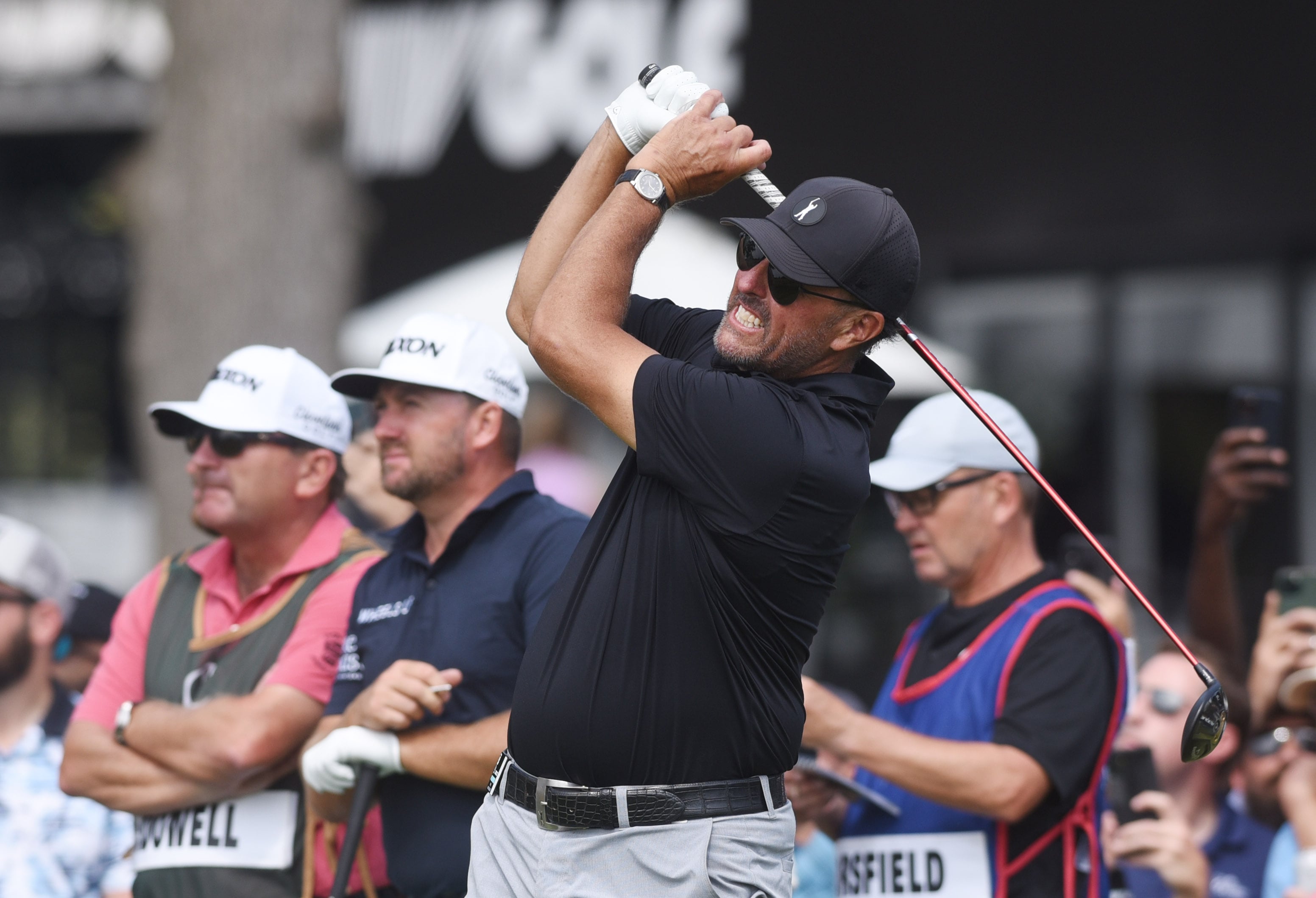 Phil Mickelson watches the flight of his tee shot on the first hole during the shotgun-start LIV Golf Invitational Chicago 2022 in Sugar Grove, Illinois on Saturday, September 17, 2022. He started the day on the 14th, two-under par.