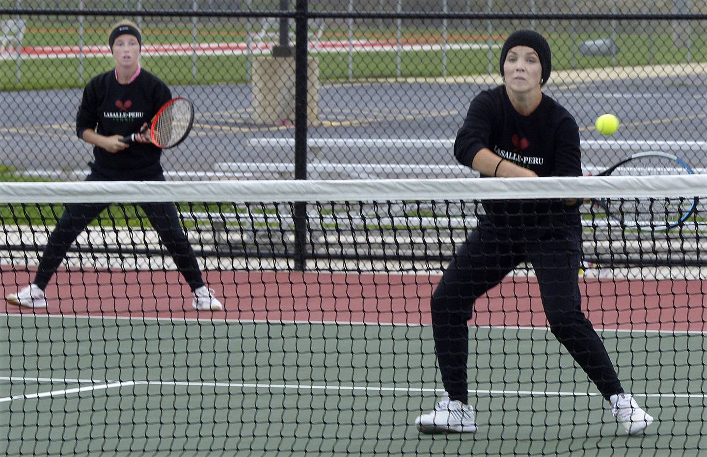 LaSalle Peru’s Kaylee Reese and Elena Leone during doubles play Saturday during the IHSA Tennis Sectional in LaSalle