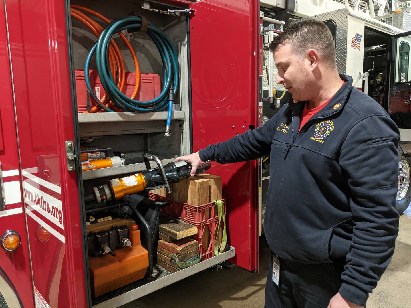 Bristol Kendall Fire Protection District Assistant Chief of Training and Safety Ryan Cihak shows some of the extrication tools on one of the department's fire trucks.