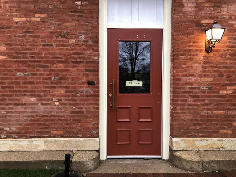 A sign reading "closed" appears on the Public House door in Woodstock April 2, 2024.