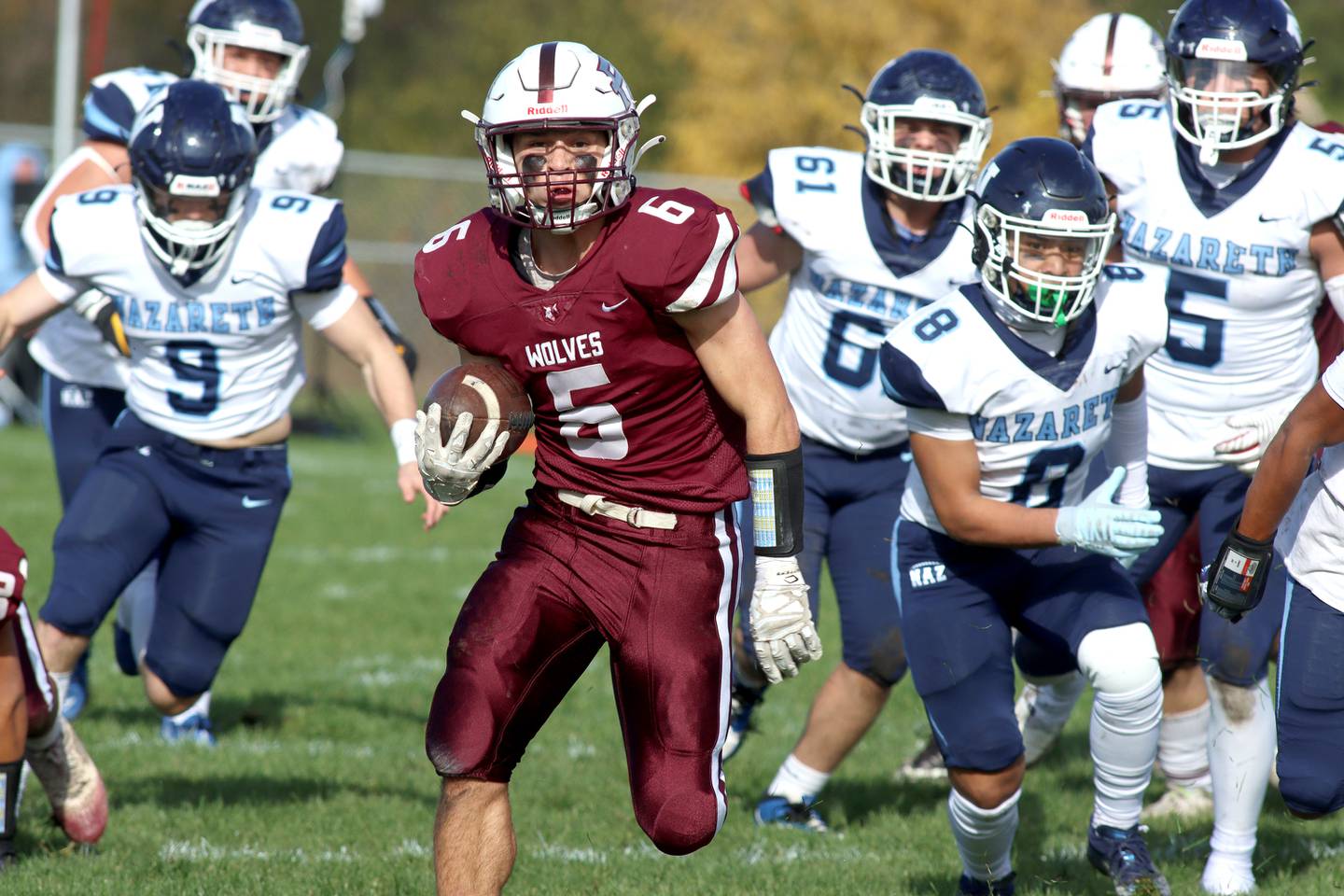 Prairie Ridge’s Luke Vanderwiel runs the ball against Nazareth in first-round Class 5A playoff football action at Crystal Lake Saturday.