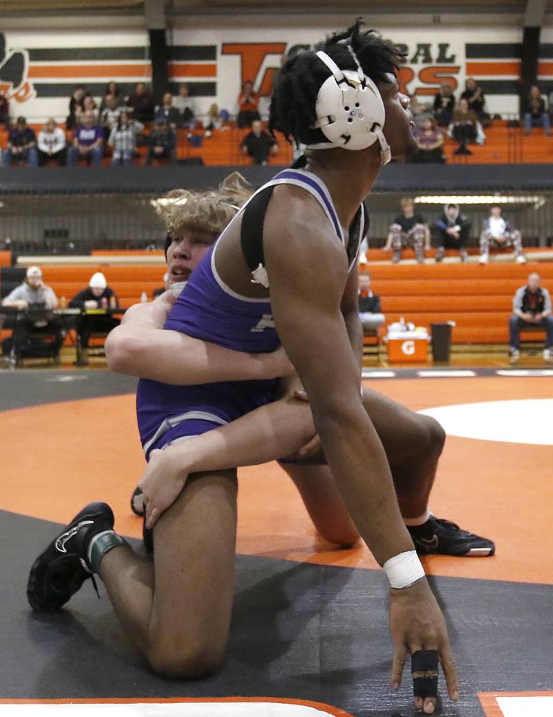 Crystal Lake Central’s Cayden Parks tries to take down Plano’s Prince Amakiri during the 190-pound championship match of a the IHSA 2A Crystal Lake Central Wrestling Regional on Saturday, Feb. 3, 2024, at Crystal Lake Central High School.