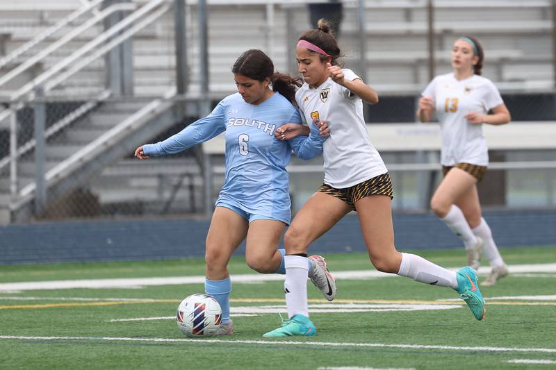 Plainfield South’s Vanessa Espinoza battles for the ball against Joliet West’s Alicia Casillas on Thursday, April 18, 2024.