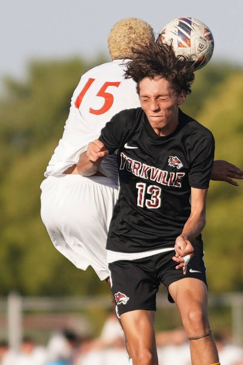 Yorkville's Alex Arriaga (13) and Oswego’s Noe Parra (15) goes up for a header during a soccer match at Yorkville High School on Tuesday, Sep 17, 2024.