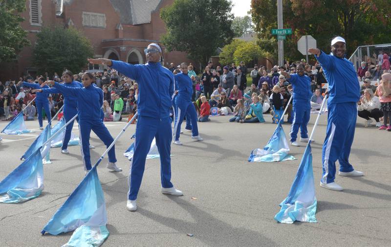 Members of the South Shore Drill Team of Chicago strike a pose as they perform in the Harvest Time Parade, held during Oregon's Autumn on Parade festival on Sunday, Oct. 8, 2023.
