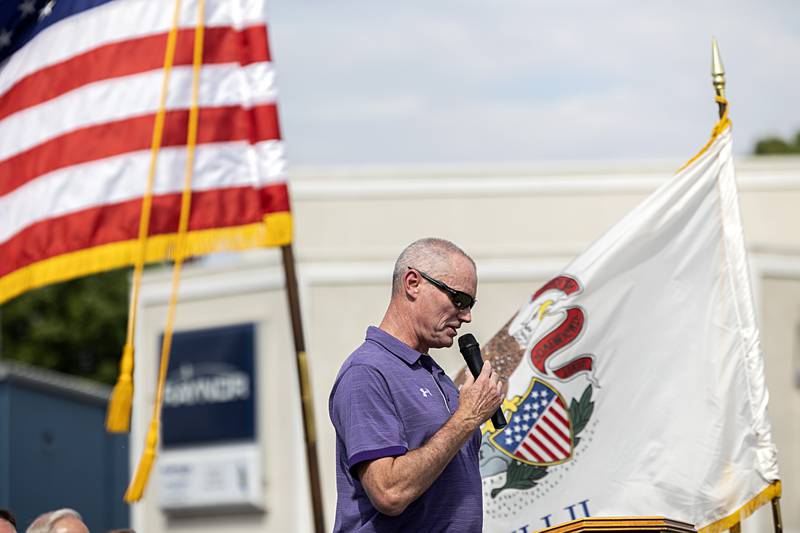 Retired Dixon Principal Michael Grady recalls how Mark Dallas was fully immersed in his job as school resource officer during the recognition ceremony Tuesday, May 30, 3034.