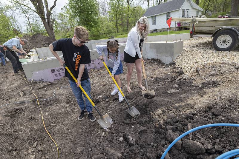 Megin Steeb with son Kayden Carter, 18, and daughter Mackenna Muhammad, 12, attend a ceremonial groundbreaking for their Habitat for Humanity home Saturday, May 4, 2024 in Dixon.