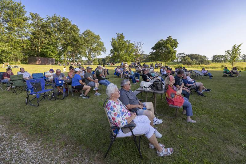 A crowd gathers on the lawn of the grist mill at Franklin Creek State Park Saturday, June 22, 2024 for a summer solstice celebration and fundraiser for the park.