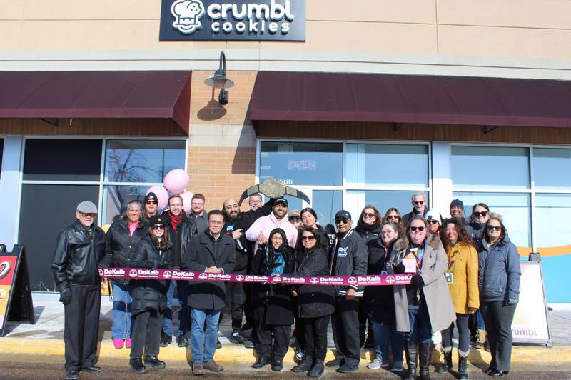 The DeKalb Chamber of Commerce celebrating Crumbl Cookies new location grand opening with a ribbon-cutting