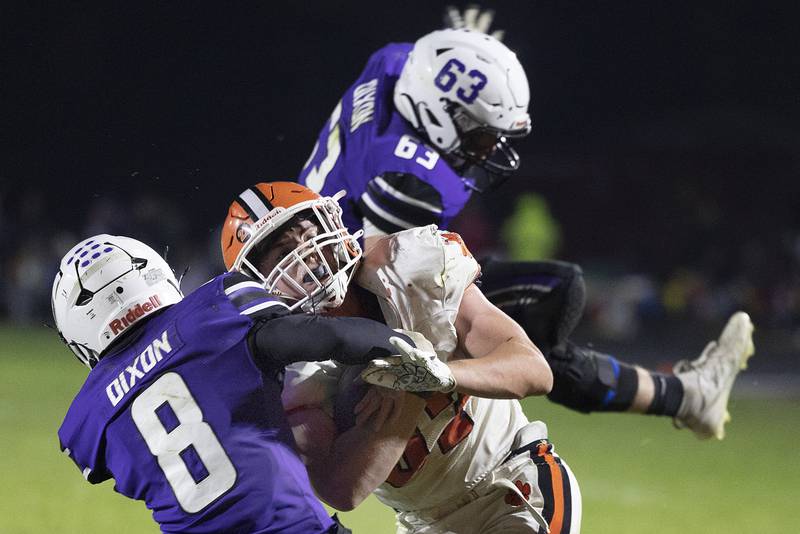 Byron’s Caden Considine fights for yards against Dixon’s Tyson Dambman Friday, Oct. 18, 2024, at A.C. Bowers Field in Dixon.