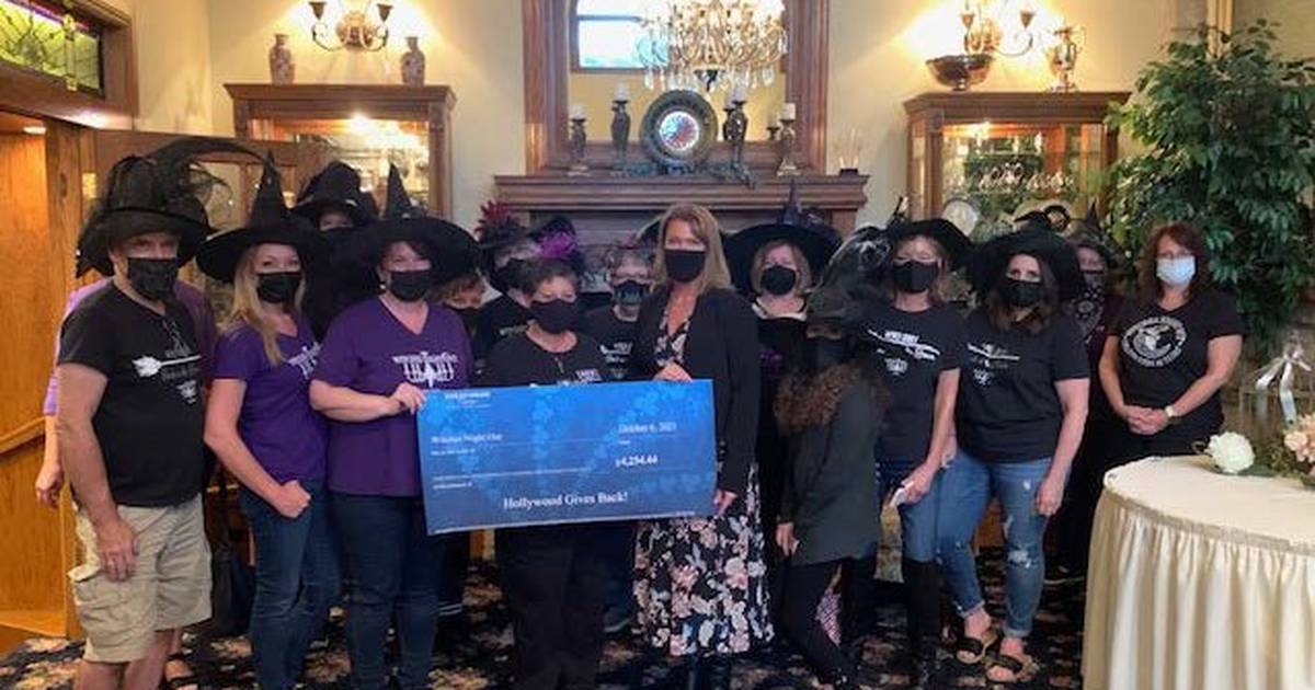 Joliet casino presents Witches Night Out committee with a check for