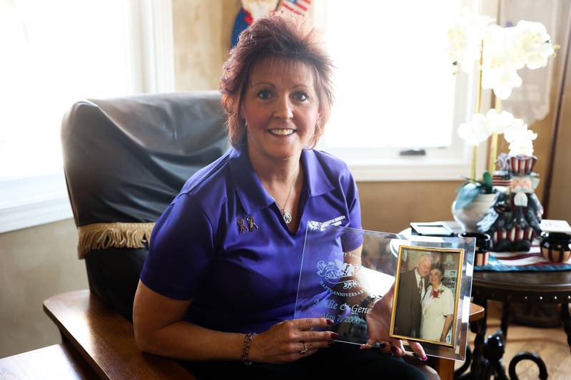 Audrey Montalto holds a photo of her parents Gene and Millie Majka, both of them passed away due to pancreatic cancer, on Thursday June 27, 2024 in Plainfield.