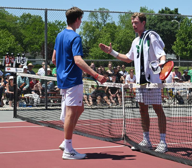 Following a moment of confusion about an official’s ruling, Marmion Academy’s Benedict Graft, left, shakes hands with Rock Island Alleman’s Nicholas Patrick, who won the Class 1A singles championship match 7-5(7-5), 6-1 during the boys state tennis tournament at Palatine High School on Saturday, May 25, 2024 in Palatine.