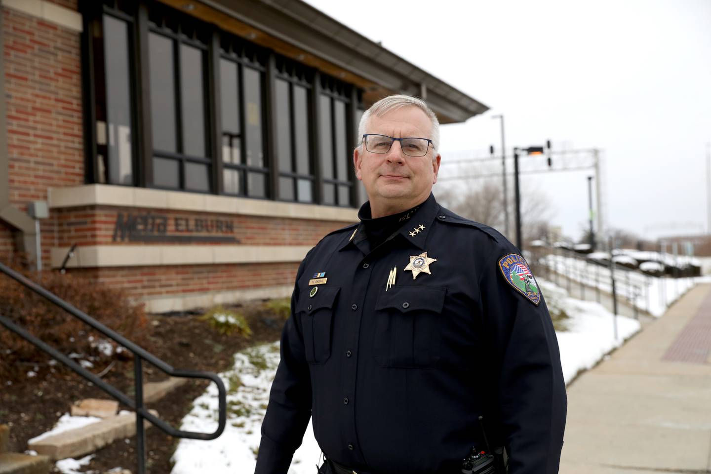 Elburn Police Chief Nick Sikora was the first officer on scene when the bus of 38 asylum seekers arrived at the Metra station Dec. 22, 2023. Thirty-two got on the train, while four were picked up by family.