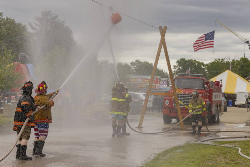 La Moille Fire Department Team 3 battles Cherry Fire Department Team 2 on Saturday, June 8, 2024, during the fire hose tug of war event at Buffalo Days in La Moille.