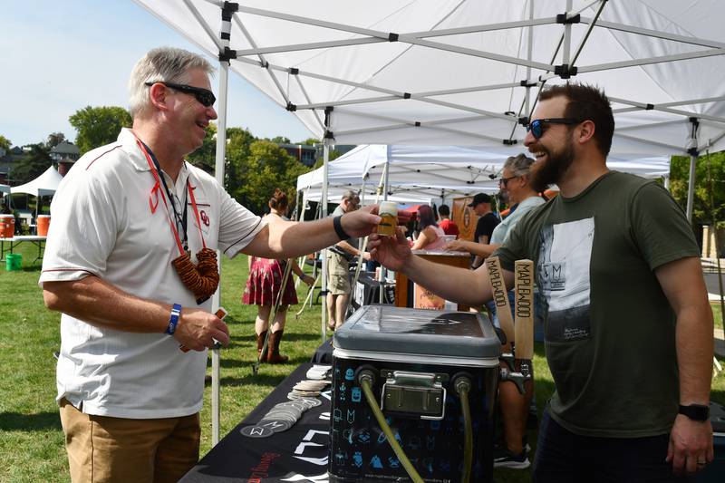 An attendee at Batavia Park District's Pints by the Pond Craft Beer Festival receives a beer to taste. The third annual festival will take place from 2 to 5 p.m. Saturday, Sept. 21 at Peg Bond Center, 151 N. Island Ave., Batavia.