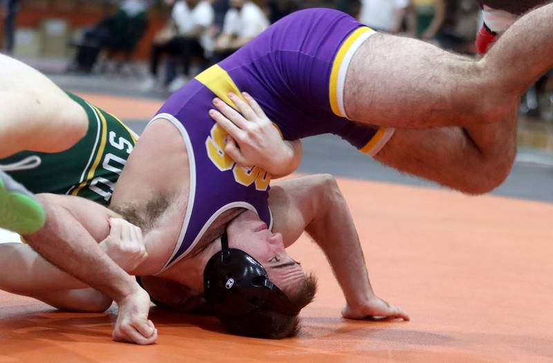 Wauconda’s Nick Bennett rolls during his win over Crystal Lake South’s Dom Ariola in a 170-pound bout during IHSA Class 2A regional wrestling at Crystal Lake Central Saturday.